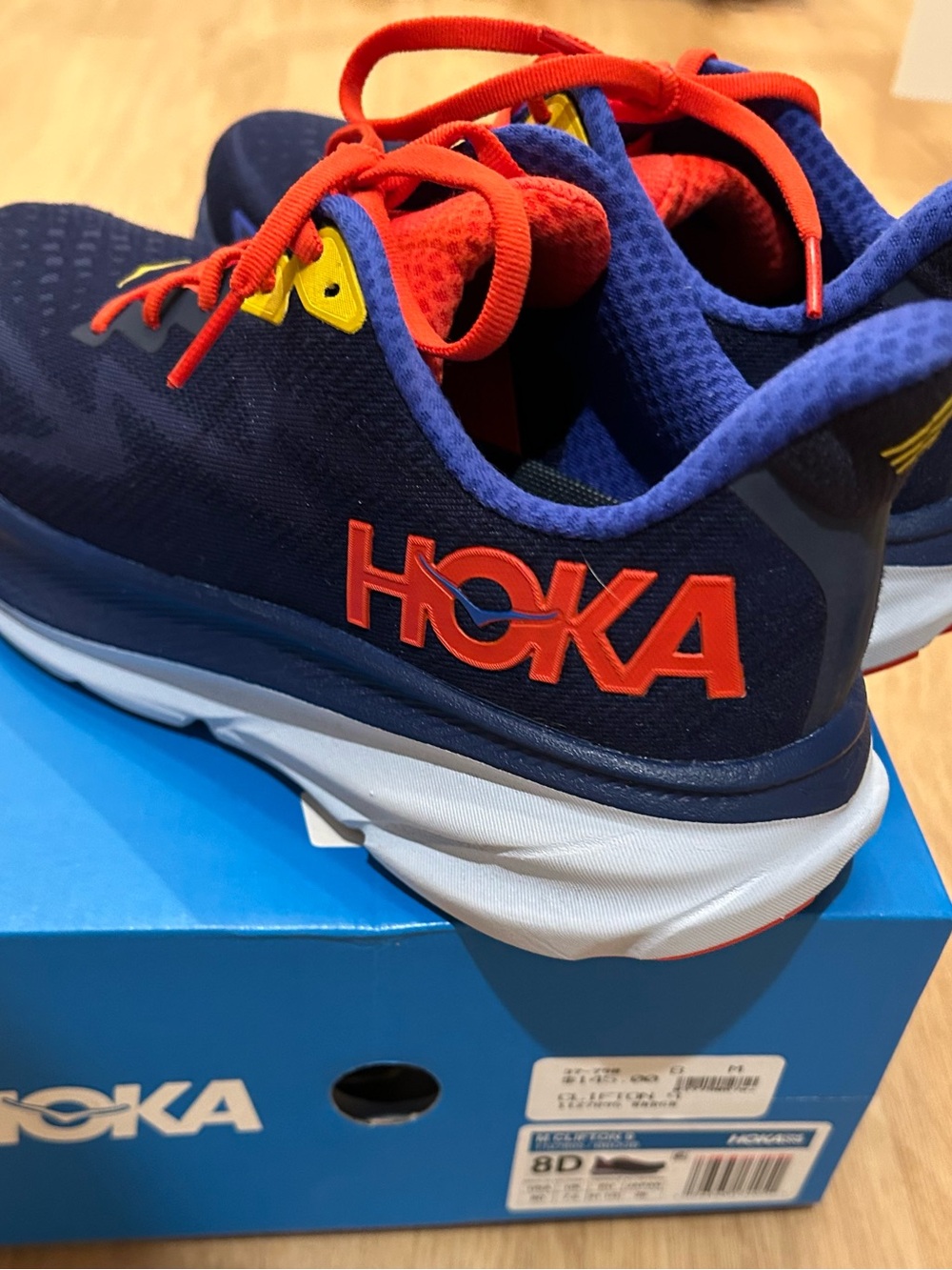 Hoka Men’s Navy Sneakers with Red & Yellow Accents
